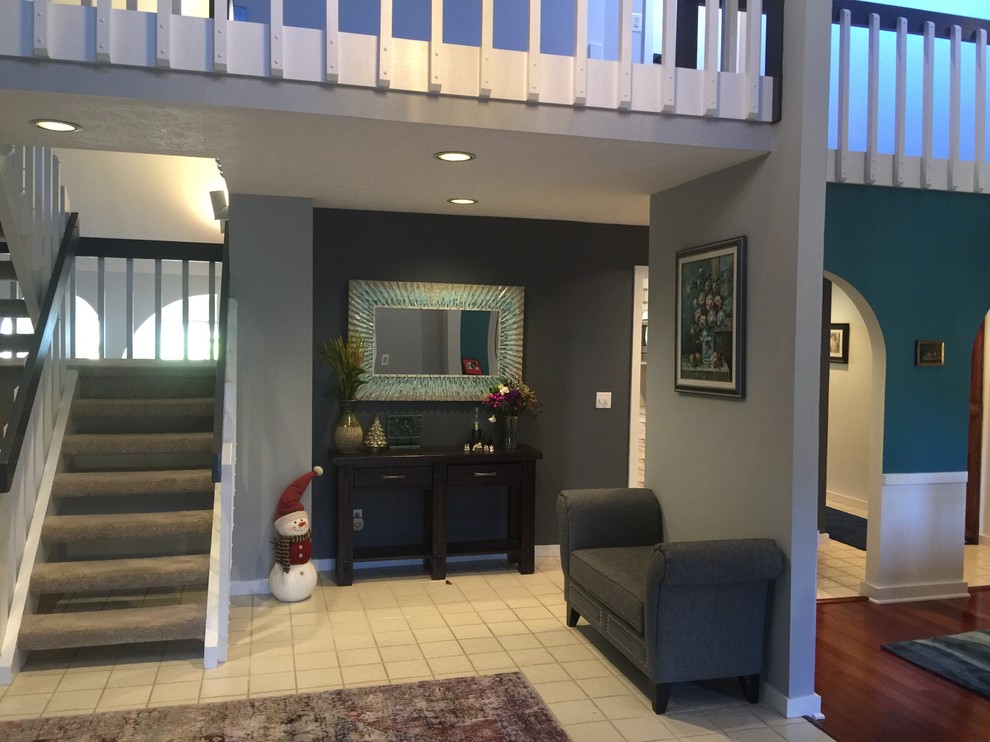 Medium sized classic foyer in Cleveland with grey walls, ceramic flooring and white floors.