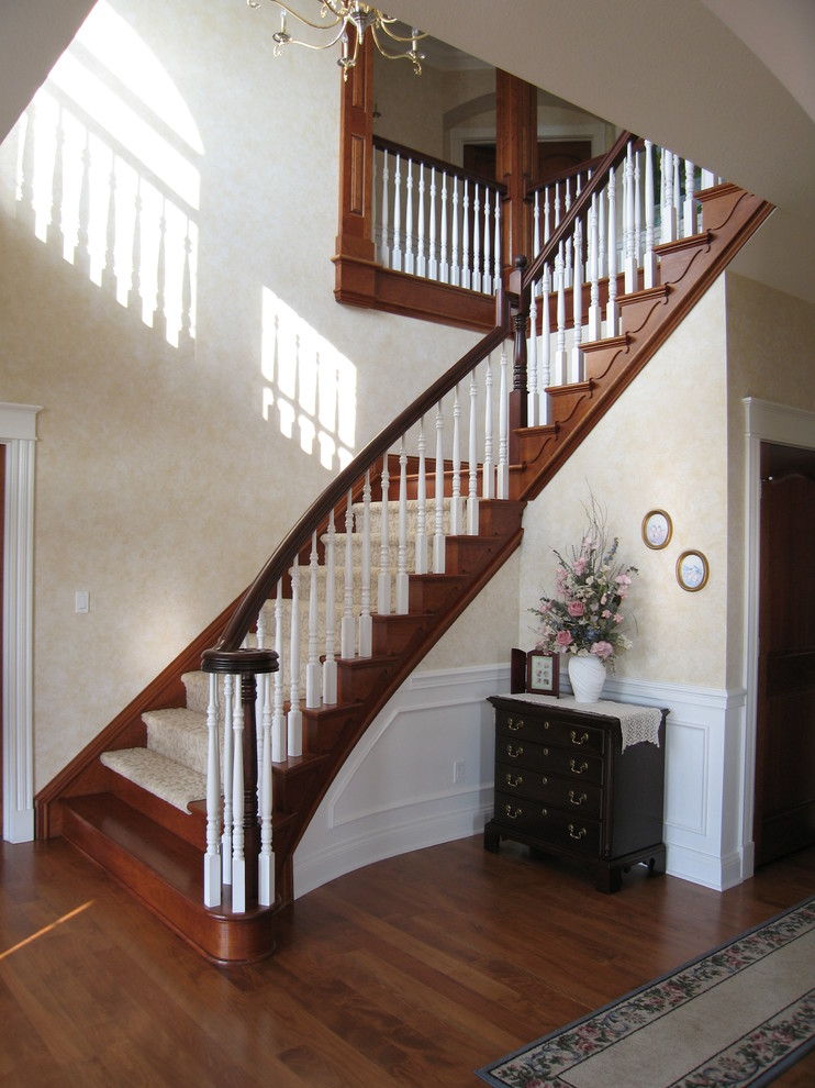 Design ideas for a medium sized traditional foyer in Cleveland with beige walls and medium hardwood flooring.