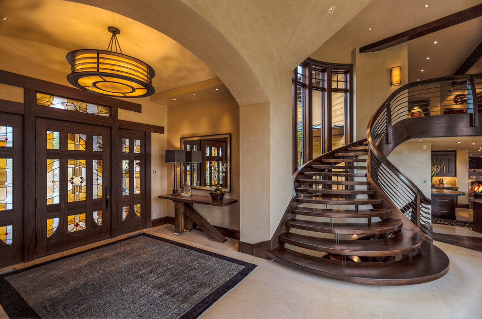 Inspiration for a contemporary entrance in Salt Lake City with a dark wood front door and beige floors.