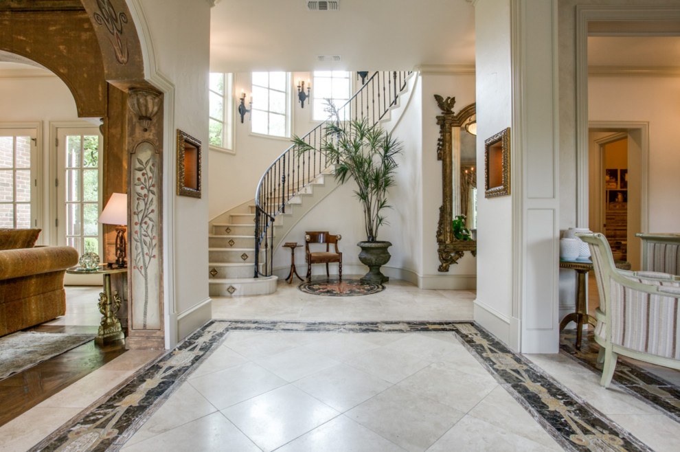 Inspiration for a large mediterranean foyer in Dallas with white walls and vinyl flooring.