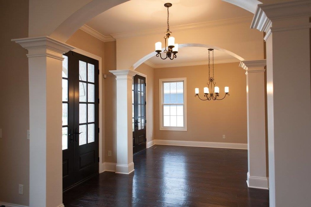Traditional entrance in Indianapolis with beige walls and laminate floors.
