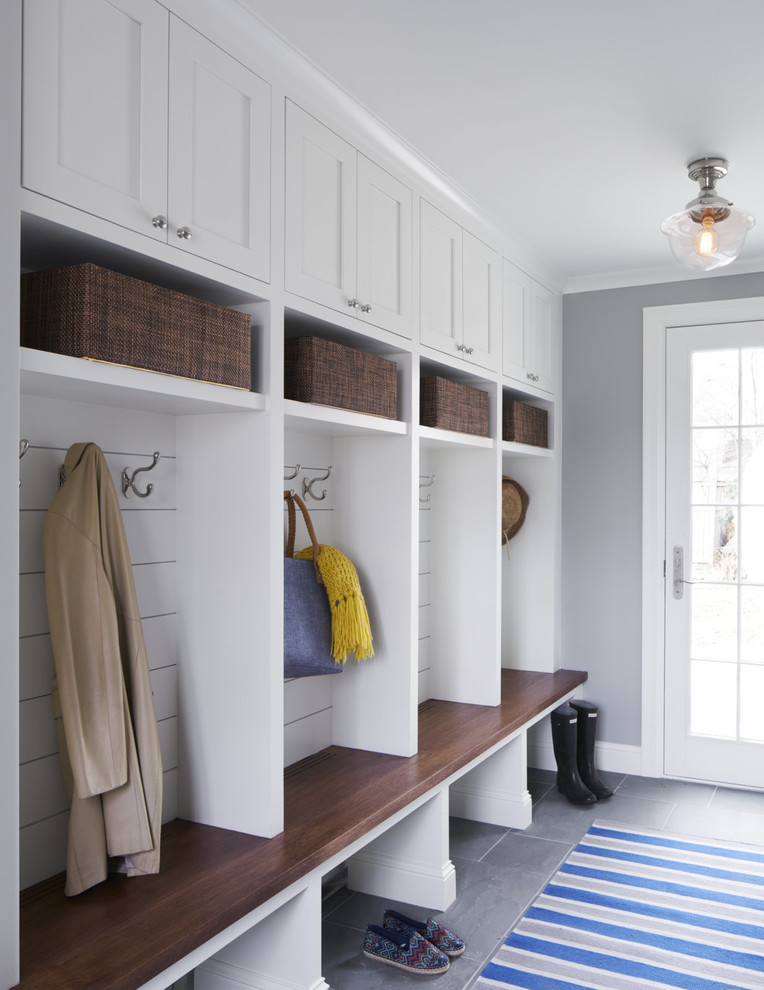 Mudroom - traditional porcelain tile mudroom idea in Minneapolis with gray walls