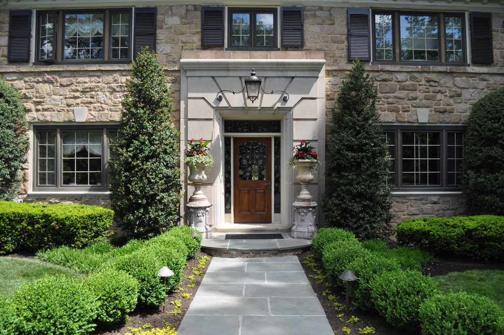 Elegant entryway photo in Philadelphia with a dark wood front door