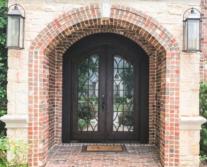 Mid-sized transitional brick floor entryway photo in Dallas with white walls