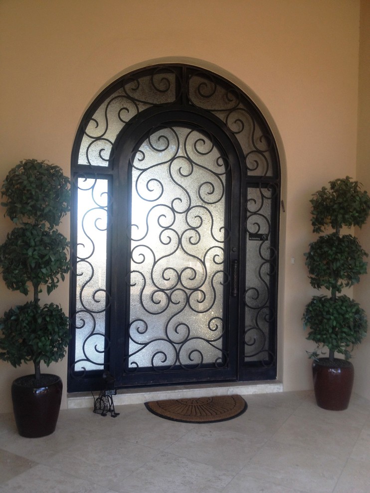 Design ideas for a large traditional entrance in Phoenix with beige walls, a single front door and a metal front door.