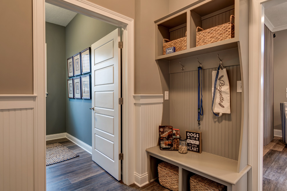 Design ideas for a classic boot room in Indianapolis with beige walls and dark hardwood flooring.