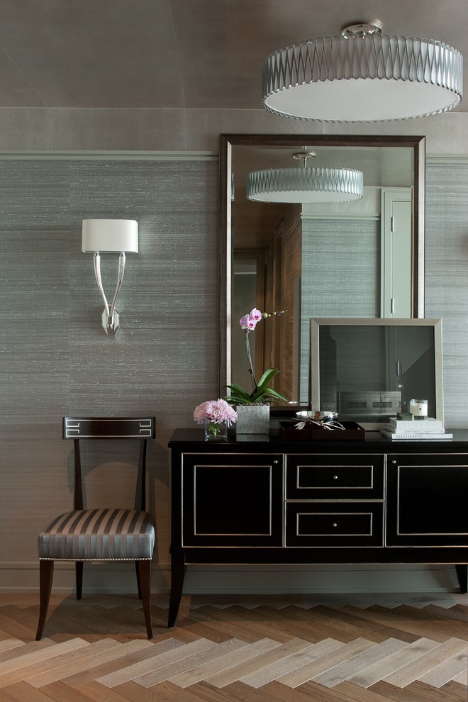 Example of a trendy medium tone wood floor entryway design in Chicago