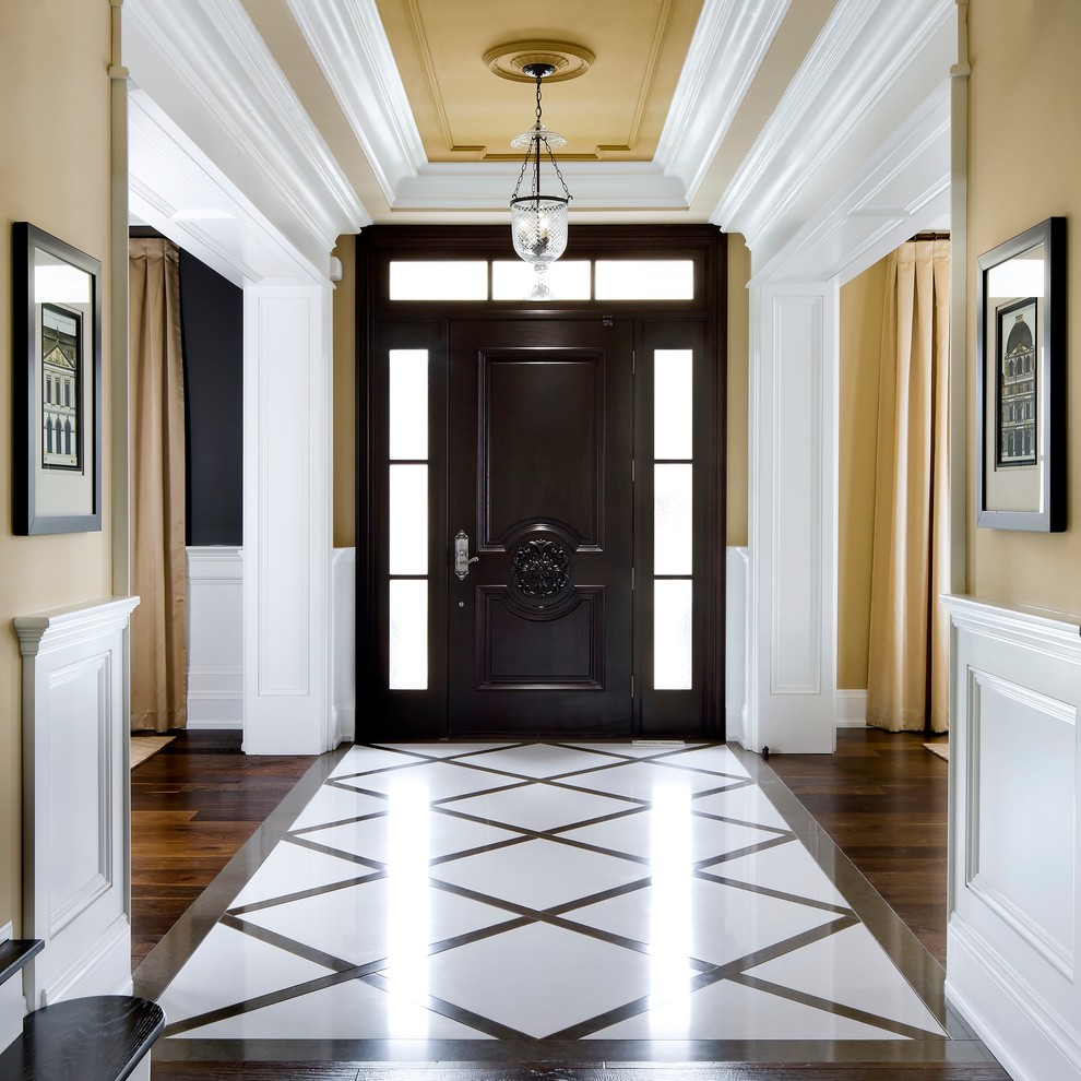 Entryway - traditional multicolored floor entryway idea in Toronto with beige walls