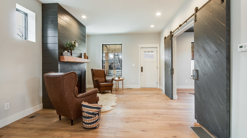 This is an example of a medium sized farmhouse foyer in Denver with grey walls, medium hardwood flooring, a single front door, a white front door and beige floors.