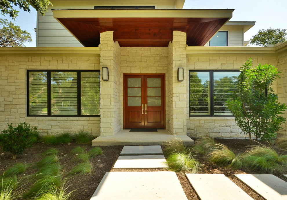 Inspiration for a contemporary porch in Austin with a double front door.