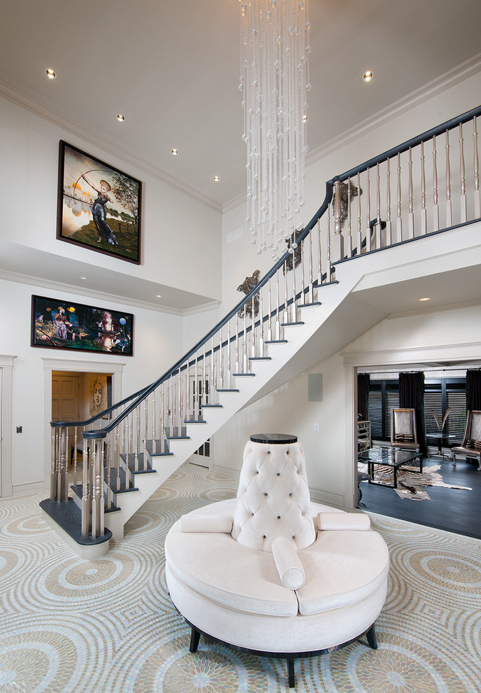 Example of a large minimalist carpeted and multicolored floor foyer design in Other with beige walls