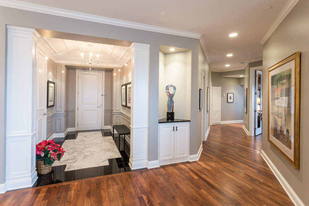 Example of a mid-sized classic marble floor entryway design in Minneapolis with gray walls and a white front door