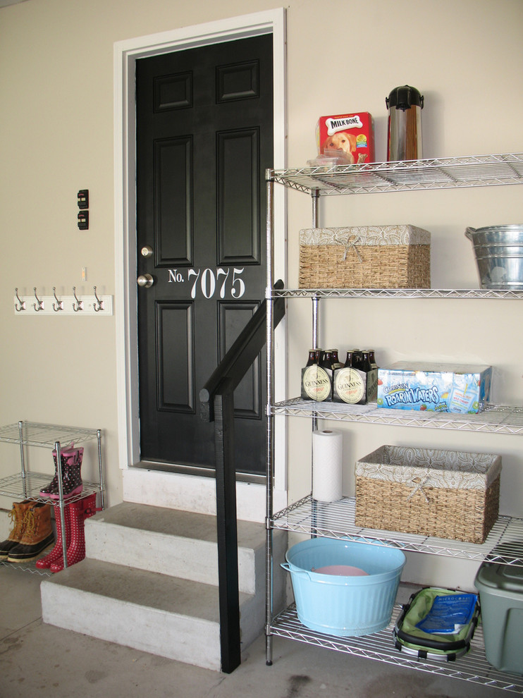 Example of a classic single front door design in Other with a black front door