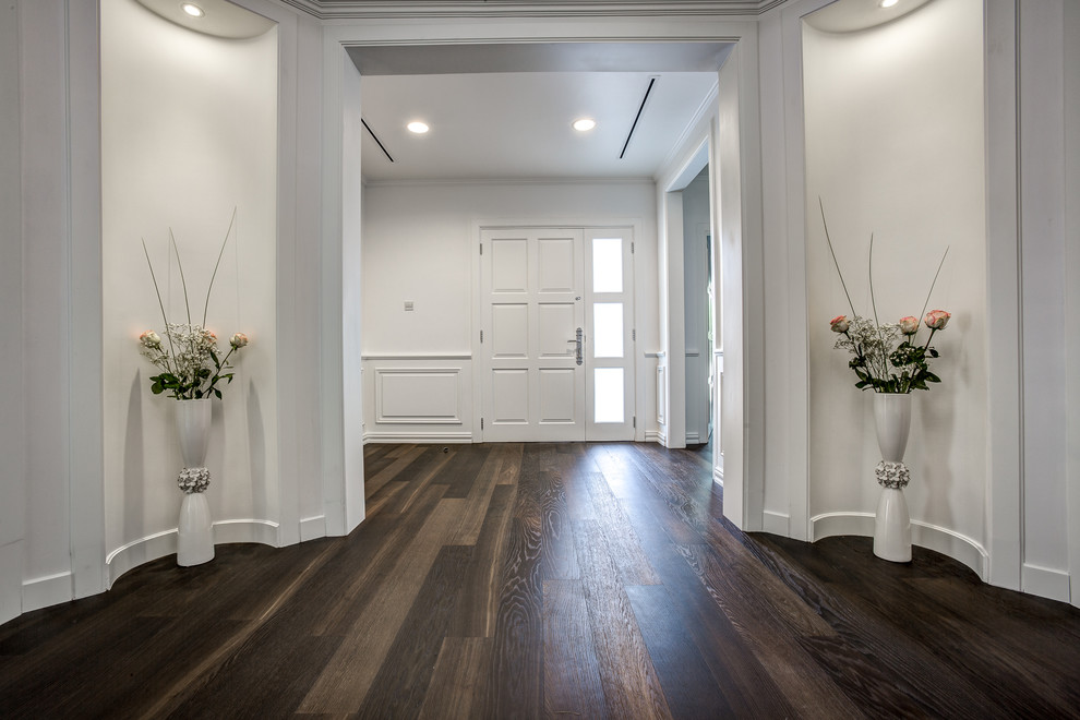 Inspiration for a large victorian dark wood floor entryway remodel in Other with white walls and a white front door