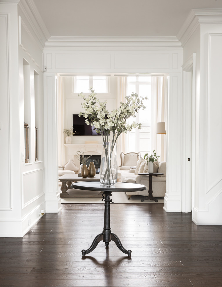 Inspiration for a classic entrance in Toronto with white walls, medium hardwood flooring and brown floors.