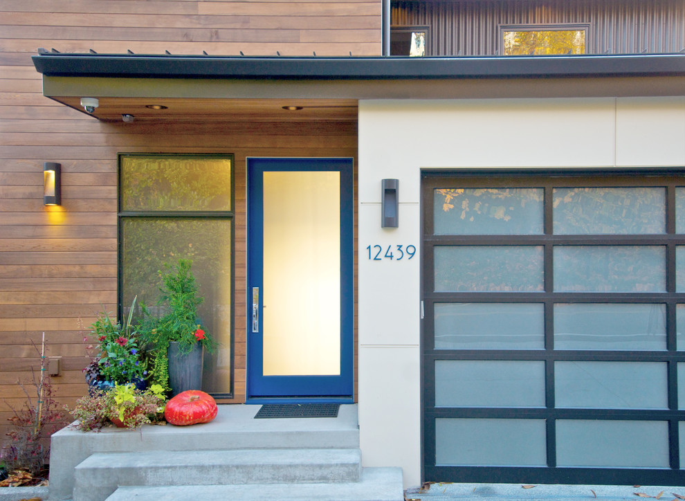 Inspiration for a contemporary entryway remodel in Seattle with a blue front door