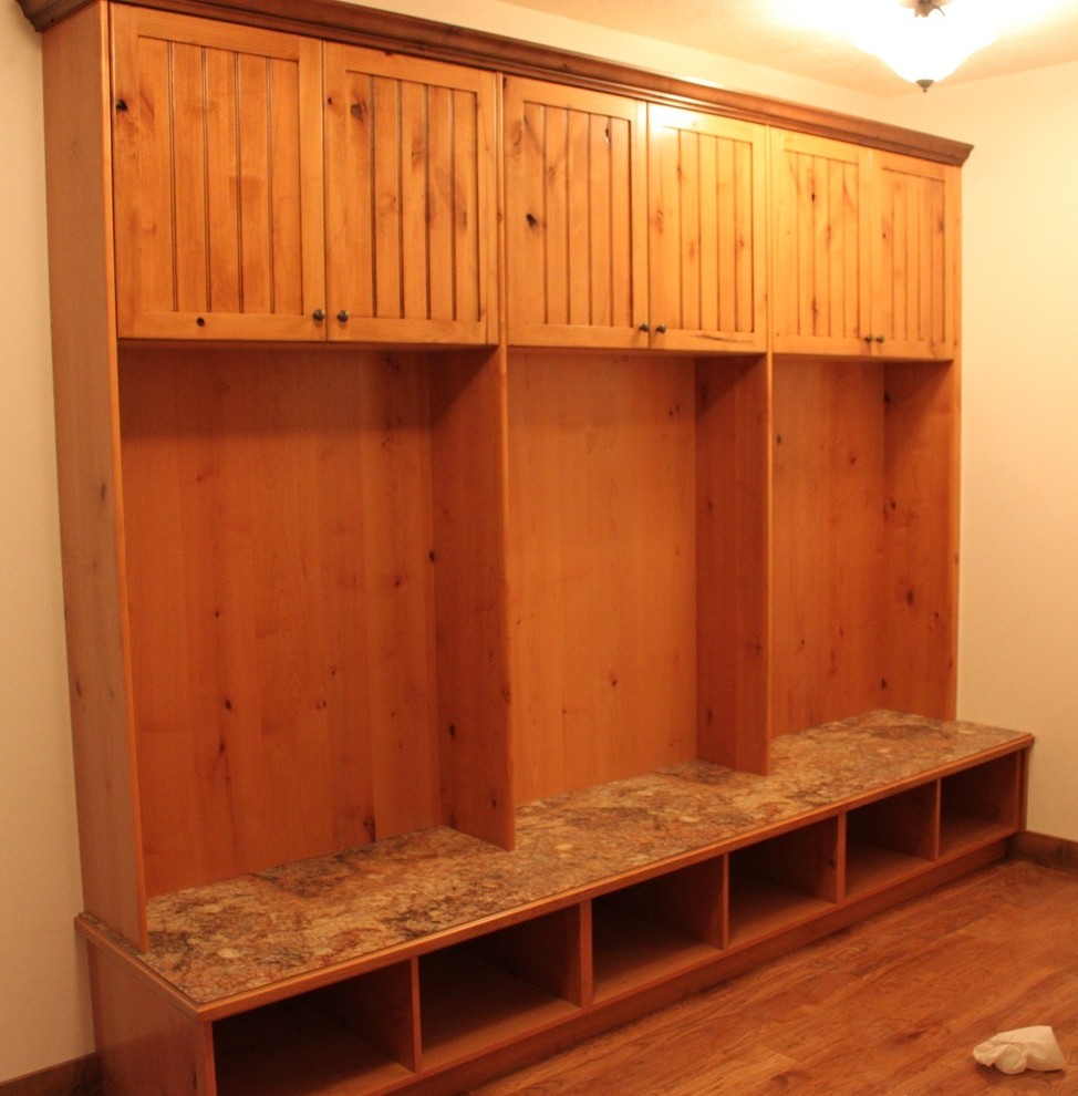 This is an example of a rustic boot room in Grand Rapids with medium hardwood flooring.