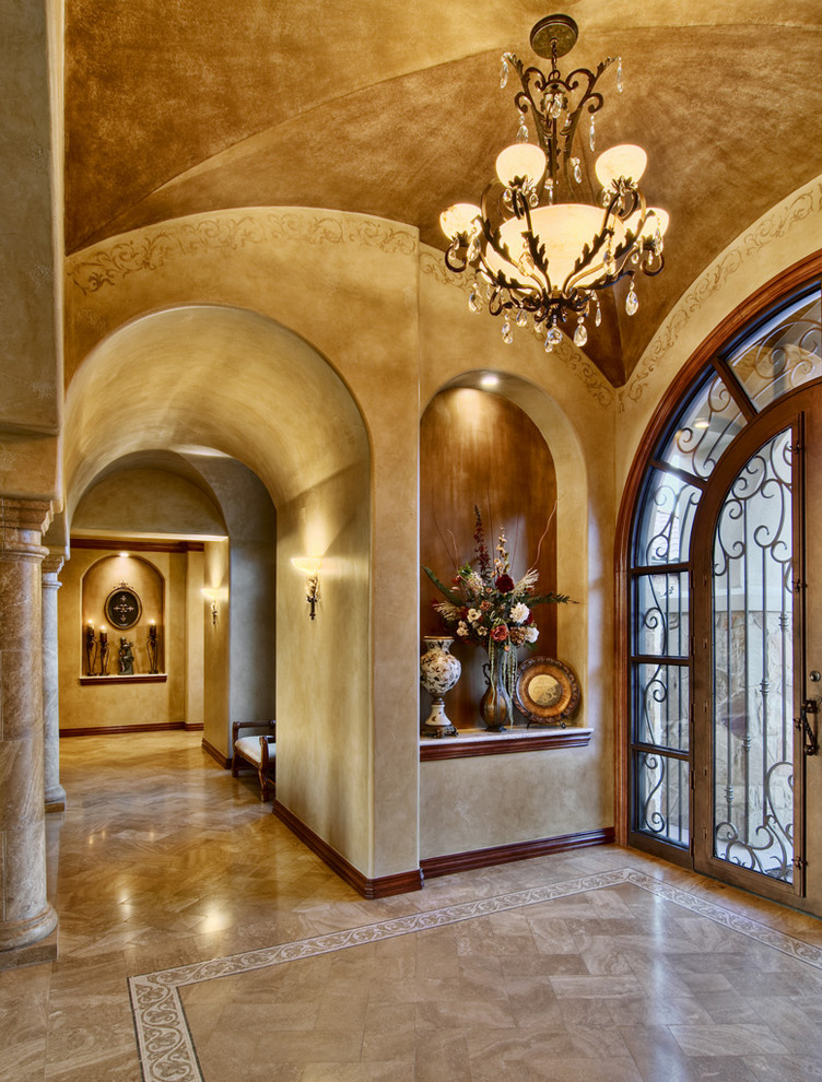 Elegant entryway photo in Austin with beige walls