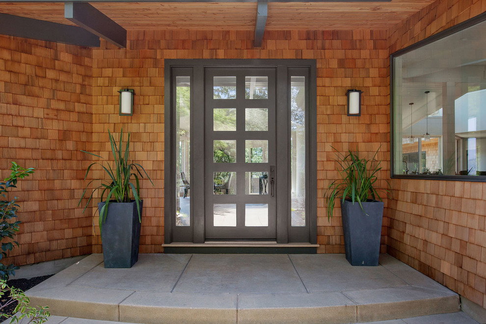 Foto di un ingresso o corridoio minimal di medie dimensioni con una porta singola