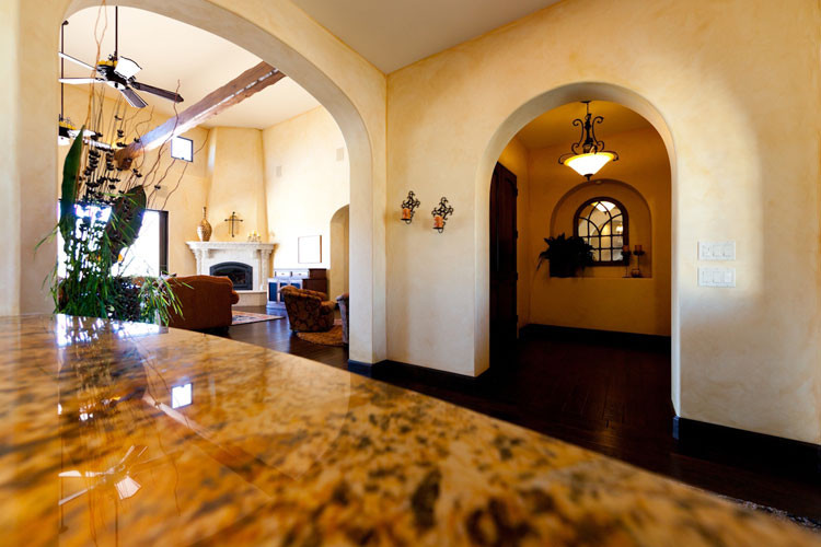Foyer - small mediterranean dark wood floor foyer idea in San Luis Obispo with beige walls