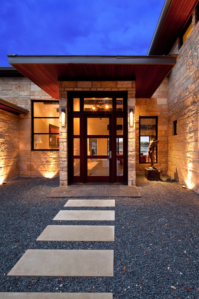 Mid-sized trendy slate floor entryway photo in Austin with a glass front door and beige walls