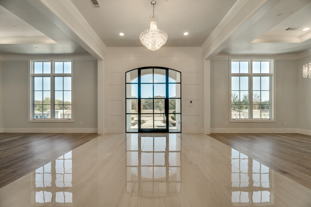 Photo of a large mediterranean front door in Dallas with a single front door and a black front door.