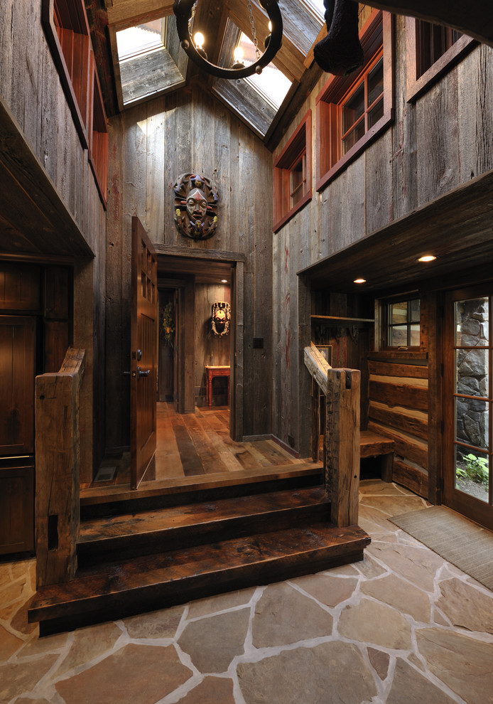 Inspiration for a rustic entrance in Minneapolis with a single front door and a dark wood front door.