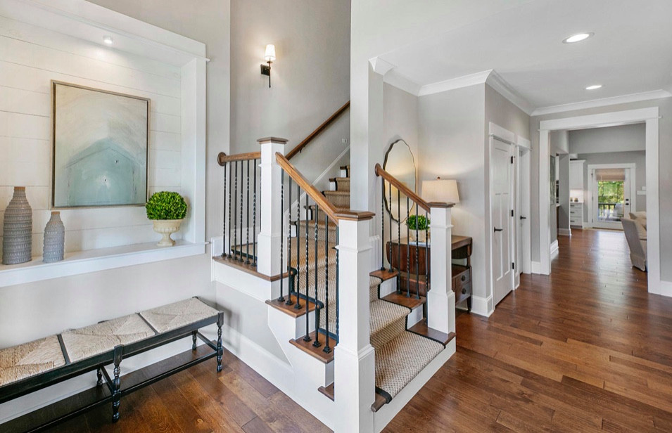 Inspiration for a medium sized classic foyer in Other with grey walls, medium hardwood flooring, a double front door, a dark wood front door, brown floors and a vaulted ceiling.