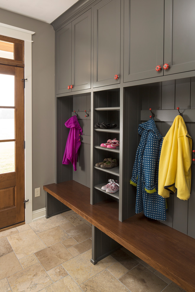 Country travertine floor mudroom photo in Minneapolis with gray walls