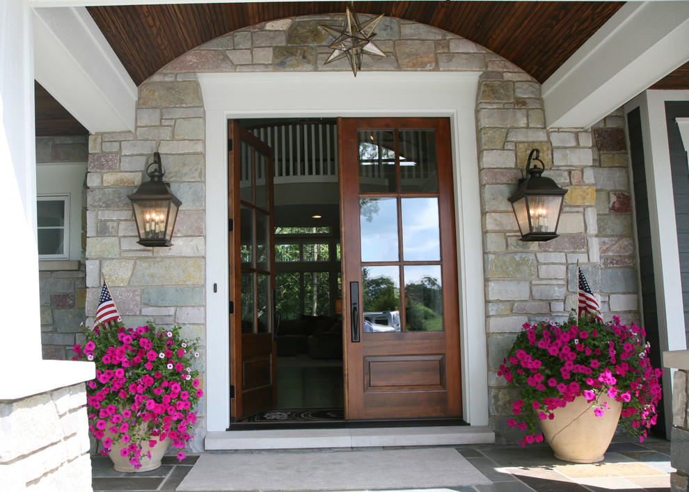 Classic entrance in Milwaukee with a double front door and a dark wood front door.