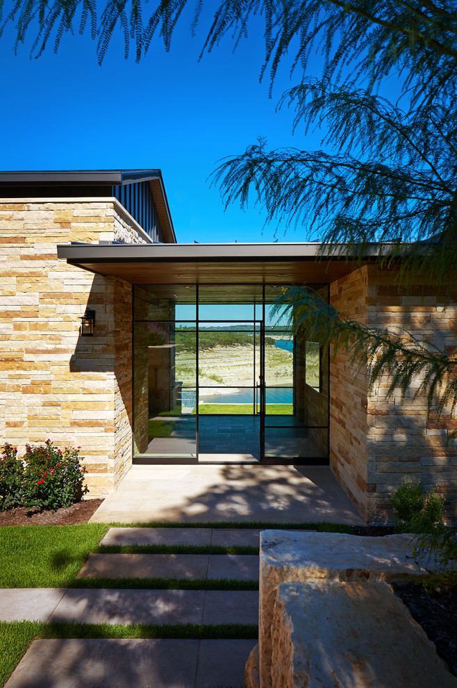Photo of a contemporary front door in Austin with a single front door and a glass front door.