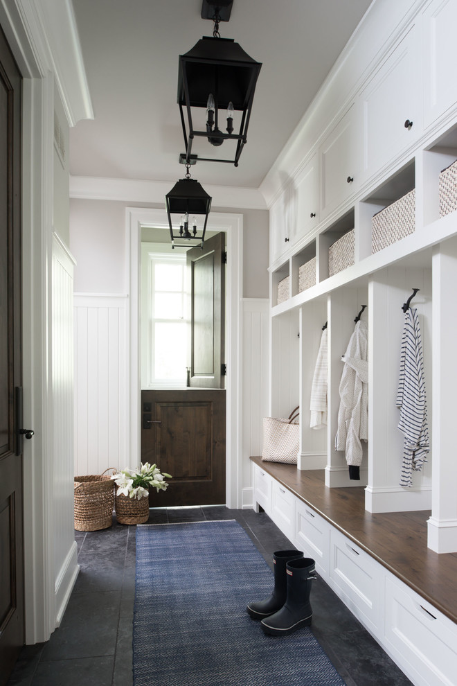 Beach style gray floor entryway photo in Minneapolis with gray walls and a dark wood front door