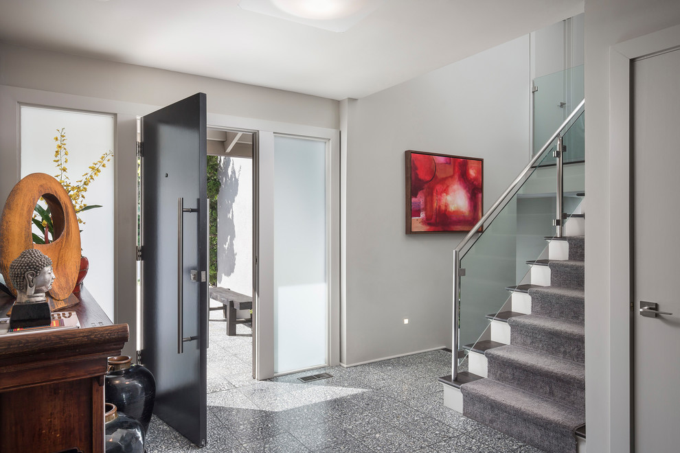Medium sized modern foyer in Other with grey walls, terrazzo flooring, a single front door, a dark wood front door and grey floors.