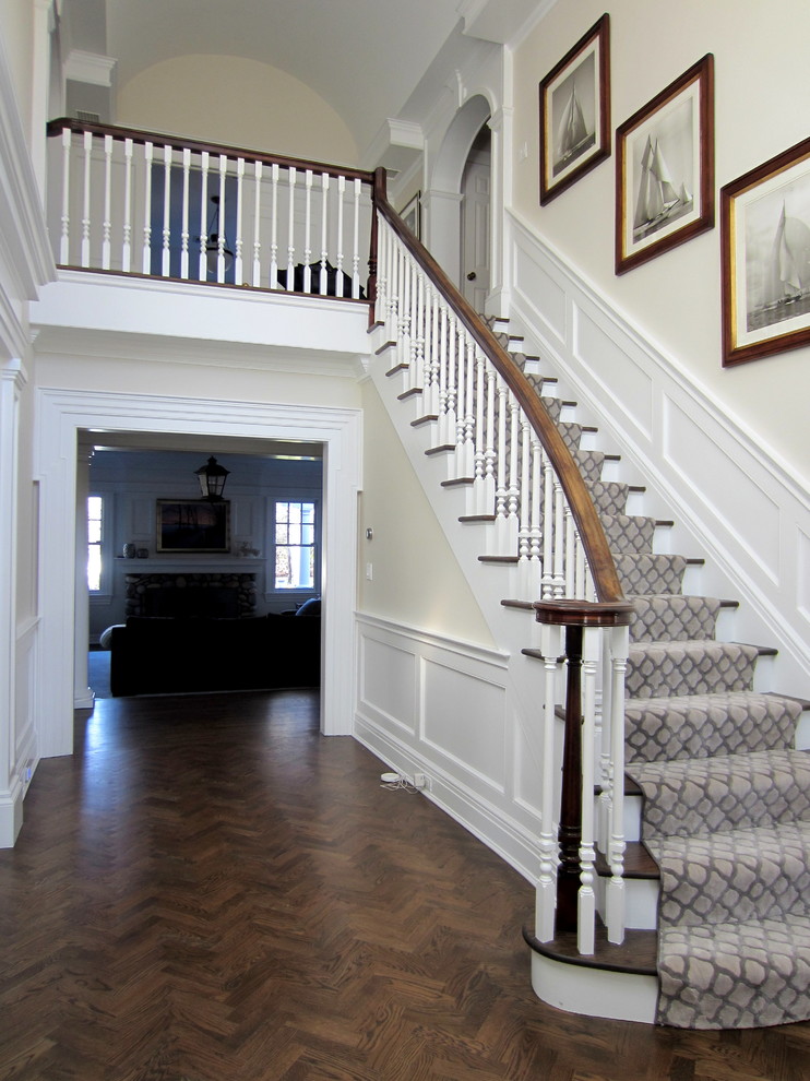 Example of a mid-sized transitional dark wood floor entryway design in New York with beige walls and a dark wood front door