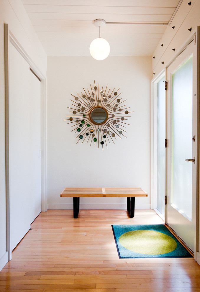 Single front door - mid-century modern single front door idea in Seattle with a glass front door