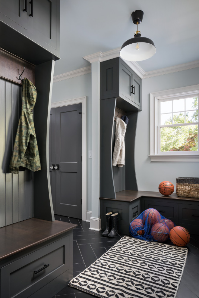 Inspiration for a medium sized traditional boot room in New York with grey walls, ceramic flooring, a single front door, a black front door and black floors.