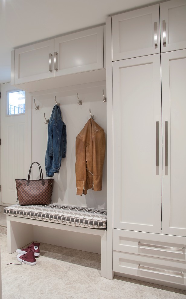 Design ideas for a medium sized traditional boot room in Toronto with marble flooring, white walls and grey floors.
