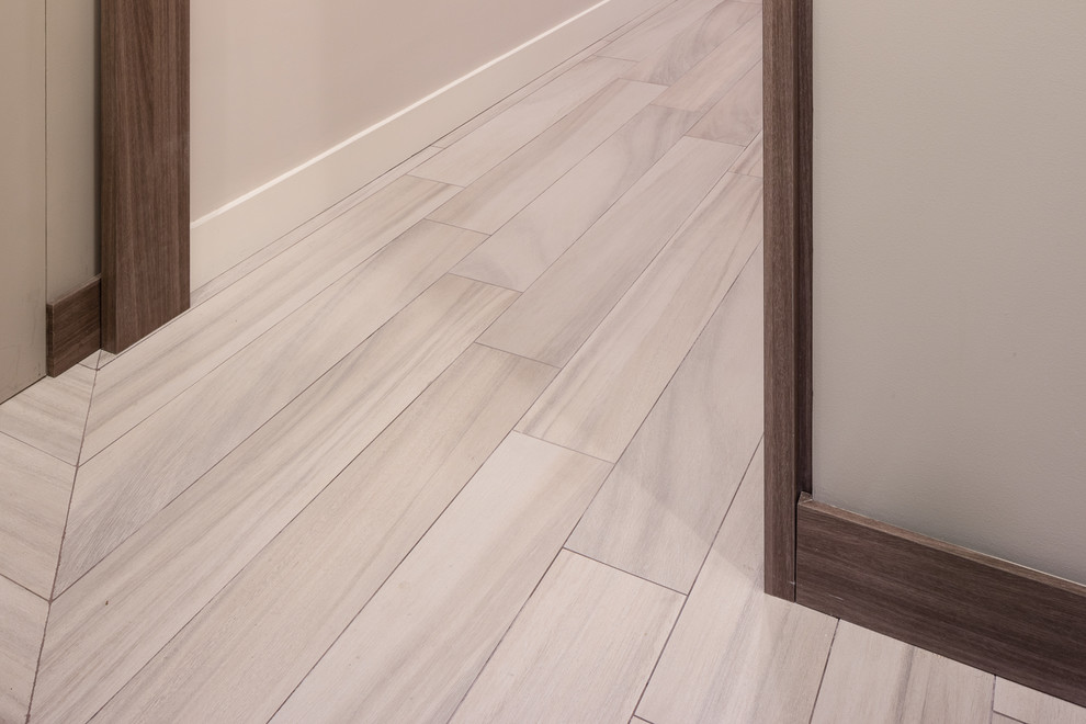 This is an example of a contemporary vestibule in New York with porcelain flooring.