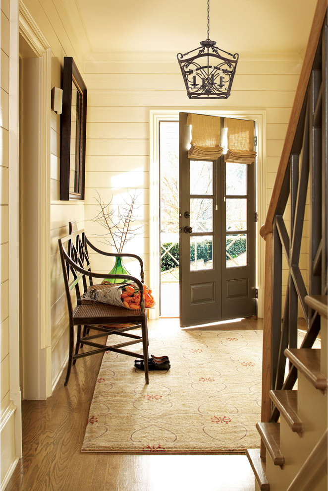 Inspiration for a farmhouse entryway remodel in Austin with beige walls and a gray front door
