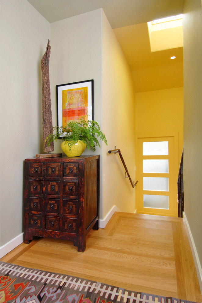 Trendy light wood floor entryway photo in San Francisco with beige walls