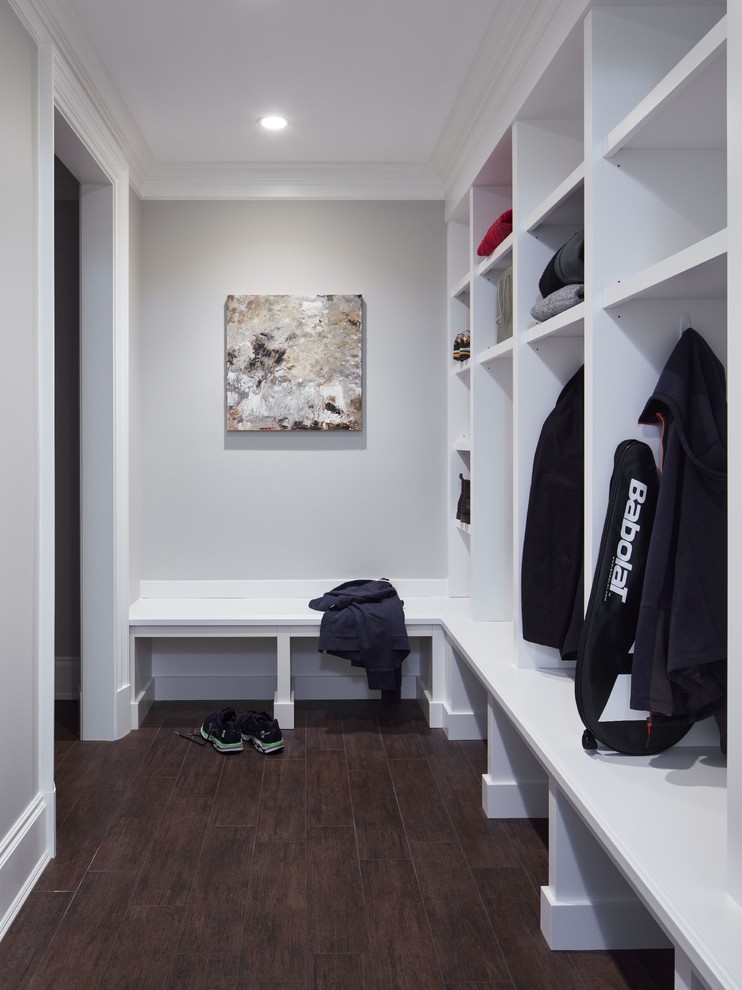 Inspiration for a large transitional porcelain tile mudroom remodel in Chicago with beige walls