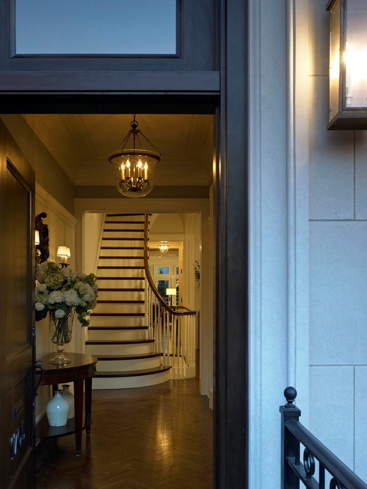 Inspiration for a large timeless dark wood floor entryway remodel in Chicago with blue walls and a dark wood front door