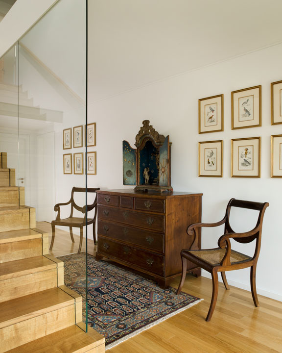 Entry hall - mid-sized traditional light wood floor entry hall idea in San Francisco with white walls