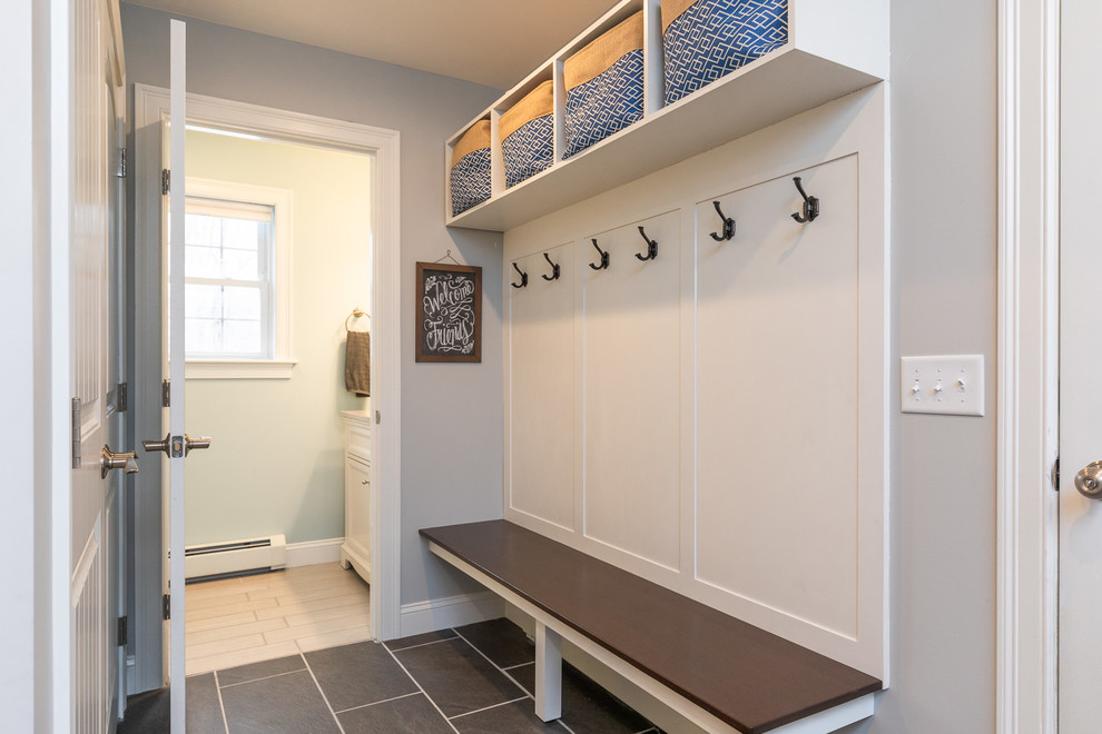 Example of a small arts and crafts slate floor and gray floor mudroom design in Portland Maine with gray walls
