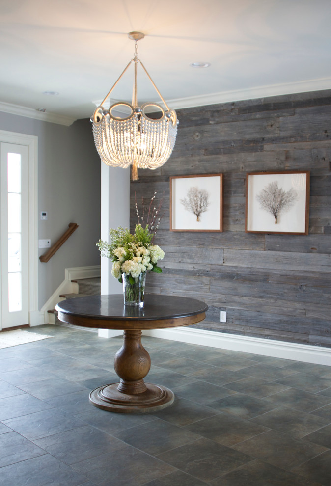 Inspiration for an eclectic foyer remodel in New York with gray walls