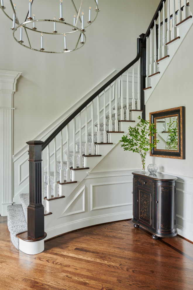 This is an example of a traditional foyer in Other with beige walls, medium hardwood flooring and brown floors.