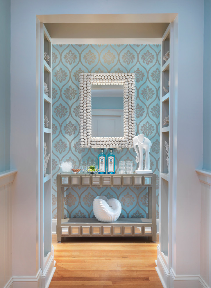 Entry hall - coastal medium tone wood floor entry hall idea in Providence with blue walls