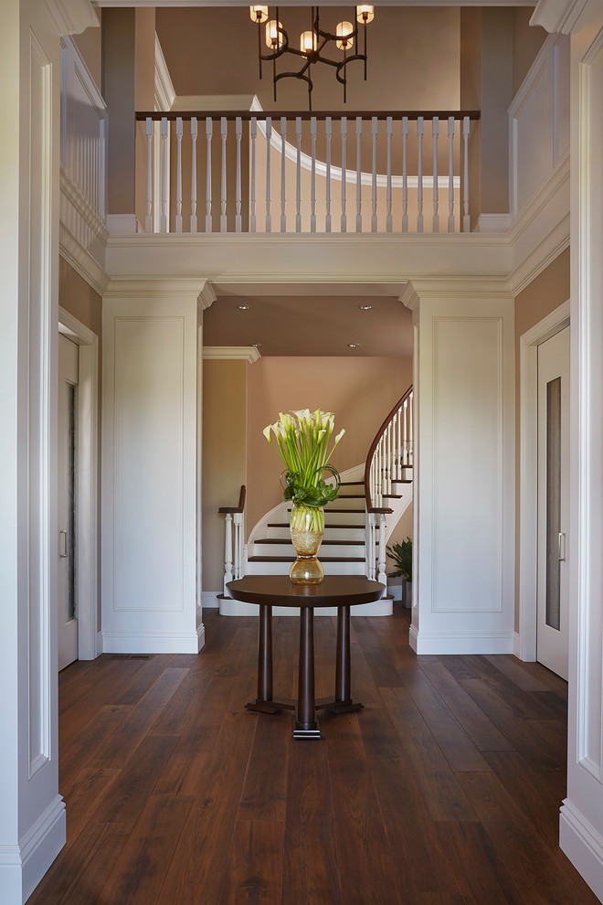 Inspiration for a large traditional foyer in San Francisco with grey walls and dark hardwood flooring.