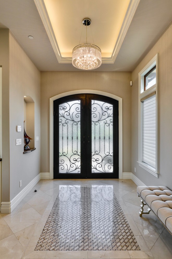 Inspiration for a medium sized classic foyer in San Francisco with beige walls, marble flooring, a double front door, a dark wood front door and beige floors.