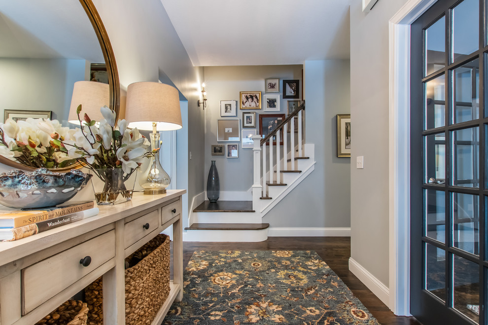 Mid-sized transitional dark wood floor and brown floor entryway photo in Other with gray walls and a blue front door